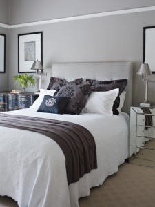 grey bedroom white bed with layers of cushions Combine grey wallpaper & curtains with throws & cushions & just add spice